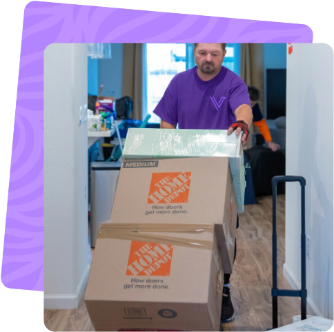 Ventura mover wheeling boxes through a home in Oxnard