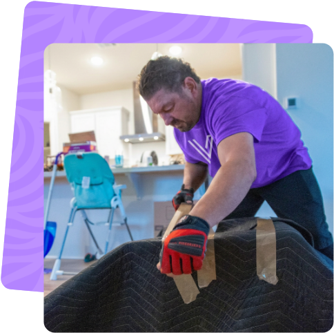 Ventura mover wrapping an item for a Simi Valley move